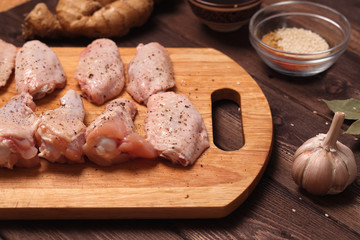Fototapeta na wymiar raw chicken wings: honey, sesame, ginger.