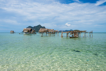 Stilted houses village occupied by the Bajau Laut of Sabah Borneo, Maiga Island in the vicinity of Sipidan Island and Tun Sakaran Marine Park, Sabah Borneo, Malaysia.