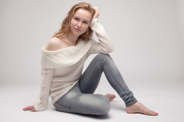 Fototapeta premium blonde in a white sweater.