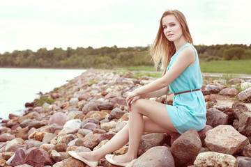 girl sitting on the rocks
