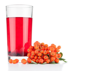 Glass with fresh juice and rowan berries on white background