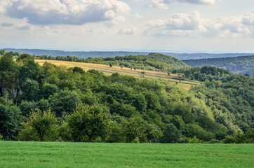 Fototapeta na wymiar Summer hills landscape. Beautiful green Jurassic hills in Poland.