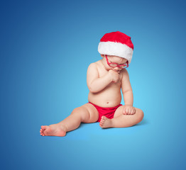 little cute baby in red Santa hat
