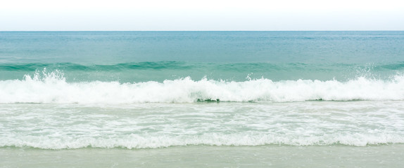 Wave of the sea on the sand beach