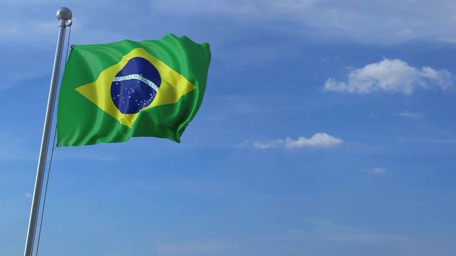 Commercial airplane landing behind waving Brazilian flag. Travel to Brazil conceptual animation