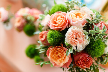 A large floral arrangement and table set for event party or wedding. The flowers decoration on the wedding table