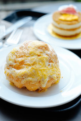 Pinoy Ensaymada bread, with sugar and cheese on top