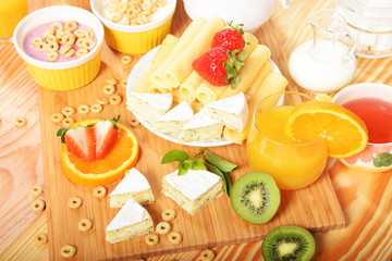 Strawberry orange and kiwi fruit on a dietetic breakfast  With yellow Swiss cheese andWhite french with mold and pepper
