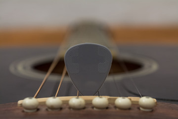 Pick on a guitar strings