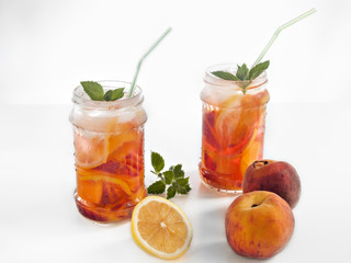 Fototapeta na wymiar Refreshing drink with peach and lemon