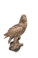 Bronze statuette sitting on a branch of an eagle and looking at camera isolated on white background