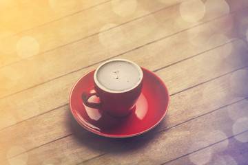 Cup of сoffee on a wooden table.