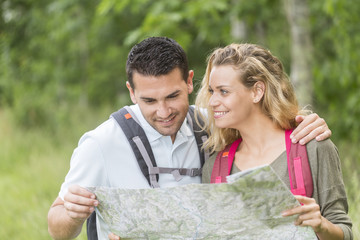 Hikers searching for the way on a map