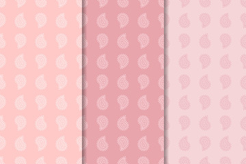 Pale pink set of paisley ornaments. Seamless patterns