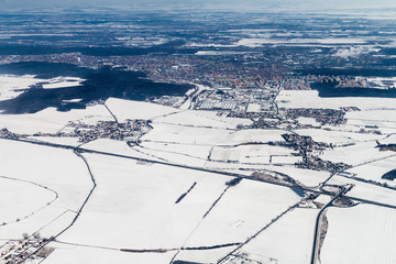 Fototapeta na wymiar Winter aerial view of the landscape of the Czech Republic. D6 freeway and Kladno city.