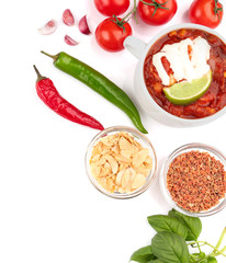 Composition with delicious turkey chili and ingredients on white background