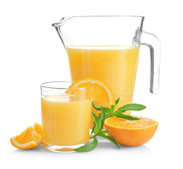 Composition with pitcher and glass of fresh orange juice on white background