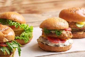 Tasty turkey burgers on table