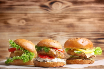 Tasty turkey burgers on table