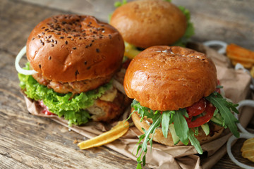 Tasty turkey burgers on table