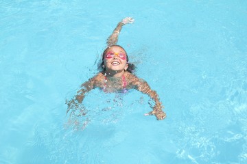 Little girl in the swimming pool