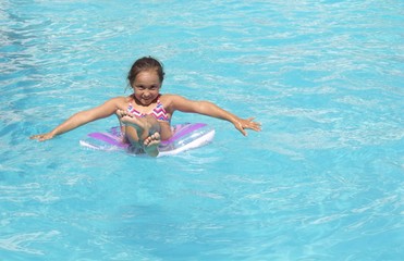 Little girl having fun in the pool