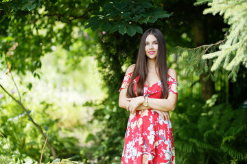 Outdoors portrait of beautiful brunette girl looking at camera