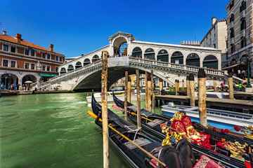 Fototapeta na wymiar Italy. Venice. The Rialto Bridge (Ponte di Rialto) - the oldest bridge spanning the Grand Canal. Venice and its Lagoon is on UNESCO World Heritage List