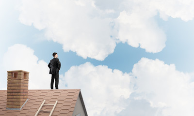 Mister boss on brick roof with arms akimbo. Mixed media