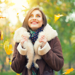 Young woman posing in autumn park