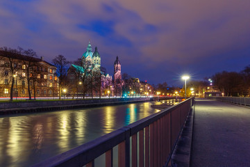 Saint Lucas Church, the largest Protestant church in Munich, and Isar River at night, Bavaria, Germany