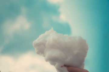 Fluffy cloud on a palm / Turquoise cloudscape behind
