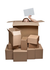 Funny girl peeking out of the box with a sheet of paper in hand