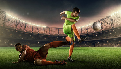 two soccer players fight for a ball