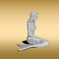 Statue of Mermaid girl with tail and shadow on gold background.