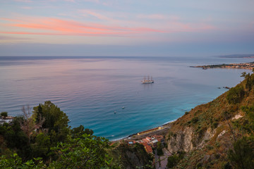 Prior sunset view on bay of Giardini Naxos from beautiful town of Taormina, Sicily island, Italy