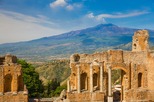 Panoramic View Of Beautiful Town Of Taormina With Its Greek Amphitheatre And Etna Volcano Background, Sicily Island, Italy