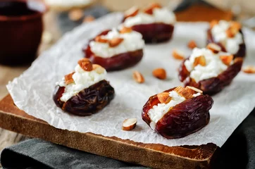 Zelfklevend Fotobehang Almond and goat cheese stuffed dates © nata_vkusidey