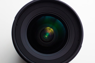 close-up view  of a camera lens on a white background