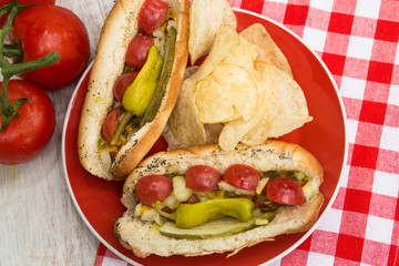 Chicago Style Hot Dogs With Potato Chips On Plate