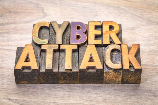 cyberattack word abstract in woodtype