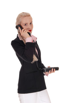 Business woman talking on an old phone