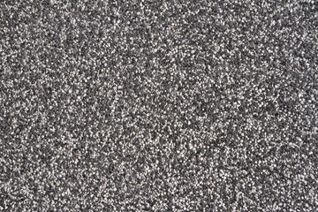 Wall of small stones texture. Pebbles and sand wall texture. Small stones wall background for design with copy space for text or image.