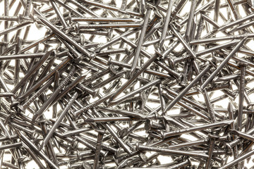 Many steel nails on white background