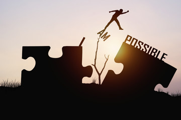 man jumping over jigsaw opposite possible shore, concept asbelieve and faith to conncet business