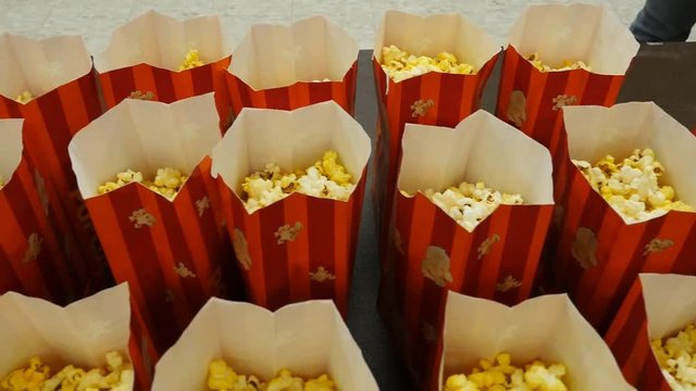 Popcorn bags lined up at a movie concession stand