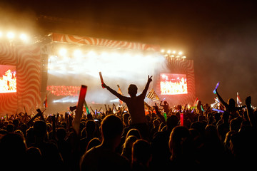Crowds Enjoying Themselves At Outdoor Music Festival, Night time