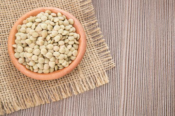 Raw lentils in the bowl - Lens culinaris