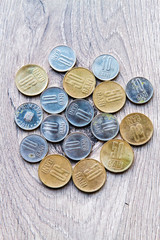 Mix of romanian coins on rustic wooden background