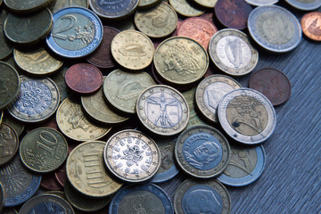 Mix of euros and cents on wooden background